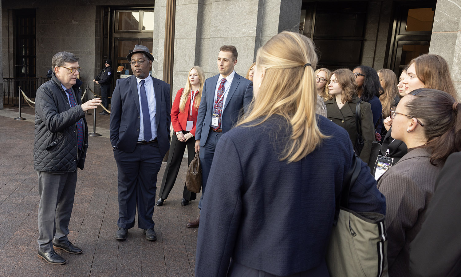 President Mark D. Gearan chats with Associate Professor of Politics DeWayne Lucas and students while touring the United States Capitol Building. 