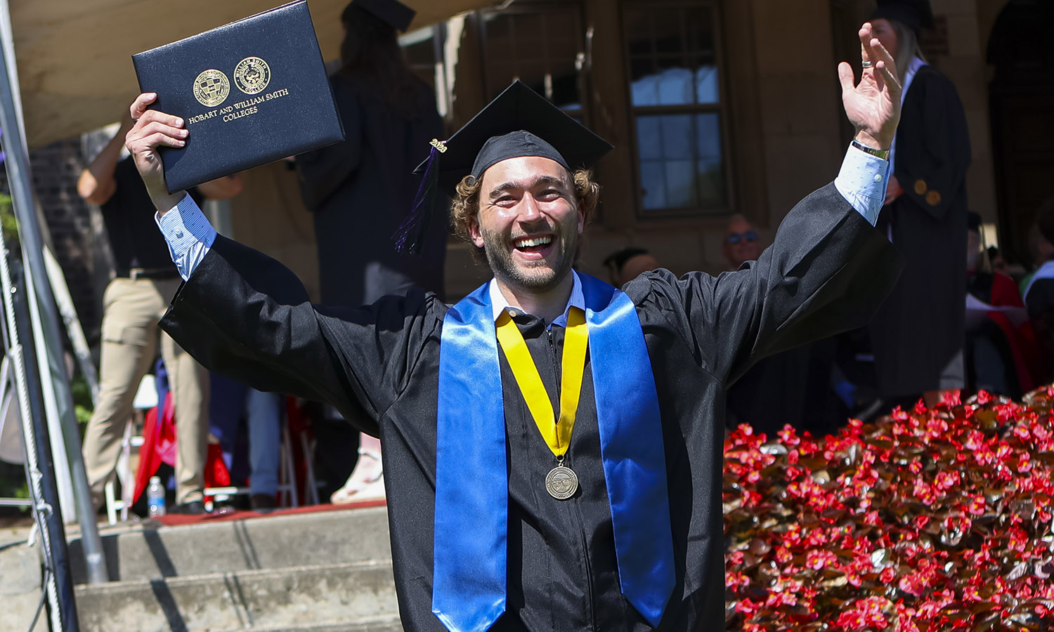 Holden May '26 celebrates after receiving his diploma.  