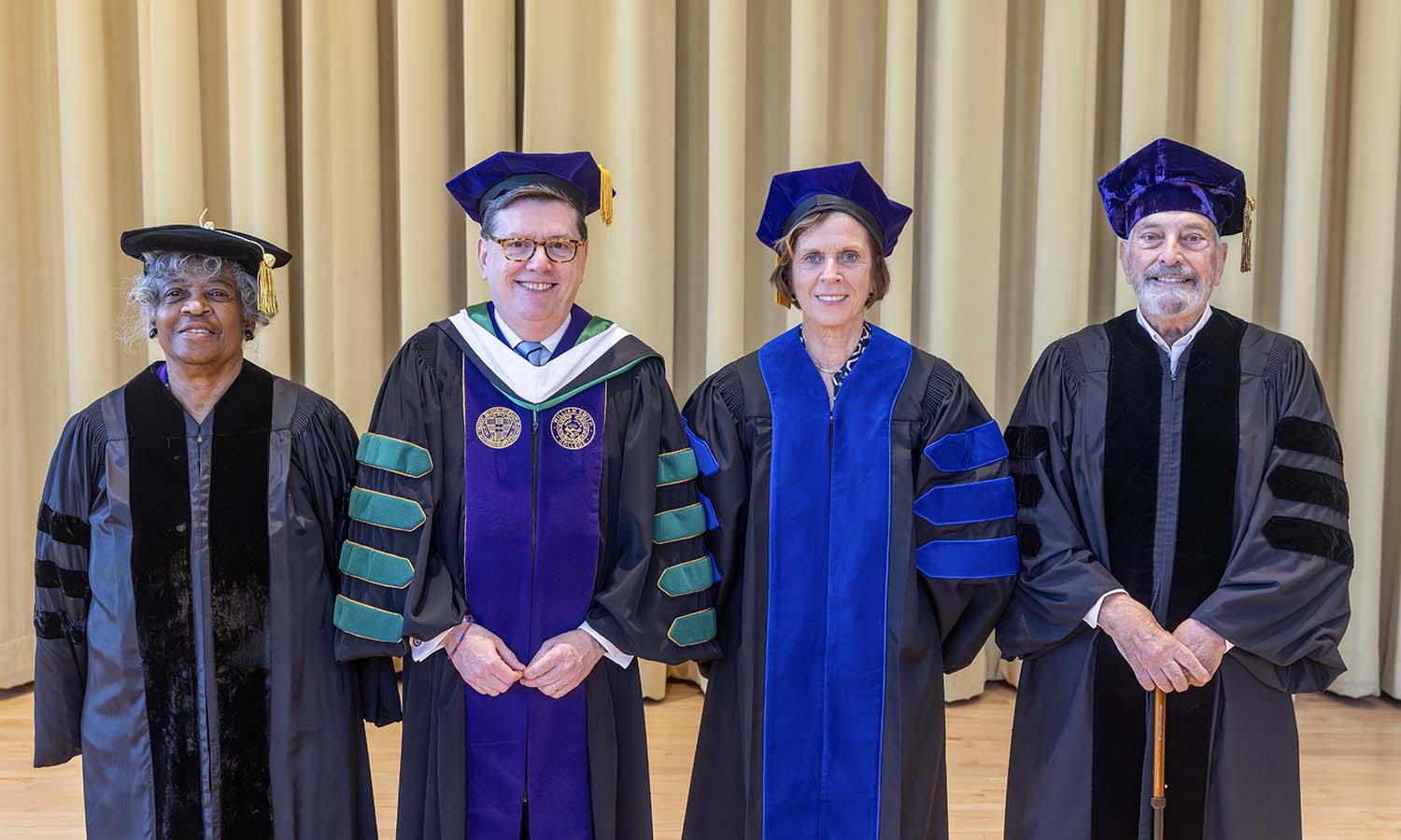 President Mark D. Gearan gathers for a photo with honorary degree recipients, including Lillian Collins L.H.D '26, Dame Louise Richardson L.H.D. '26 and Lt. General John L. Woodward Jr. ’68, L.H.D. ’26.  