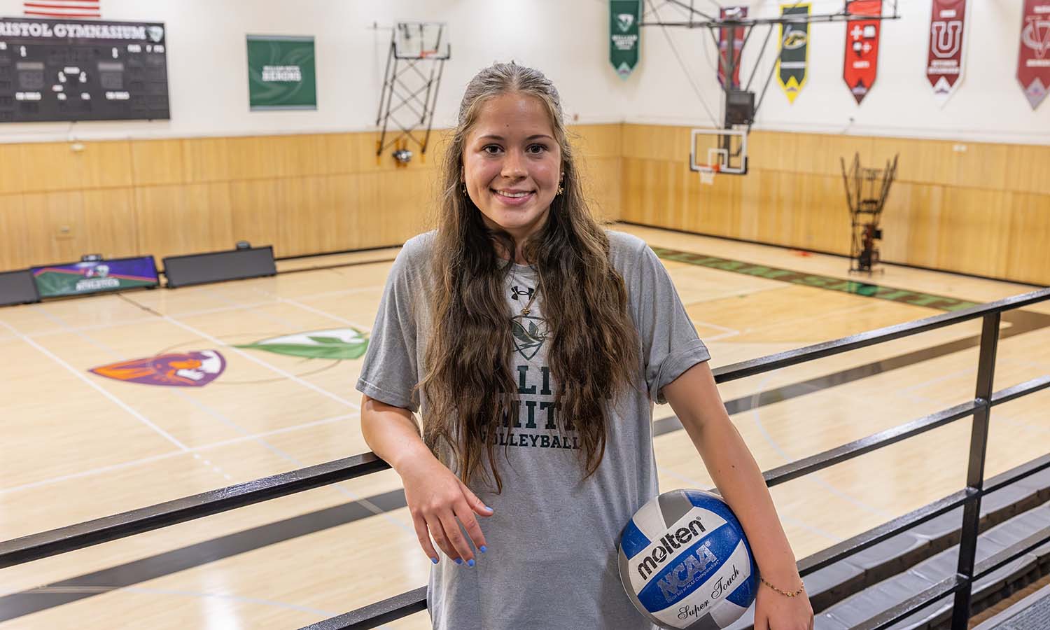Kali Vanderhoof ’28 poses in Bristol Gym, the home court of William Smith volleyball, where she gets to play her favorite sport with her best friends. 