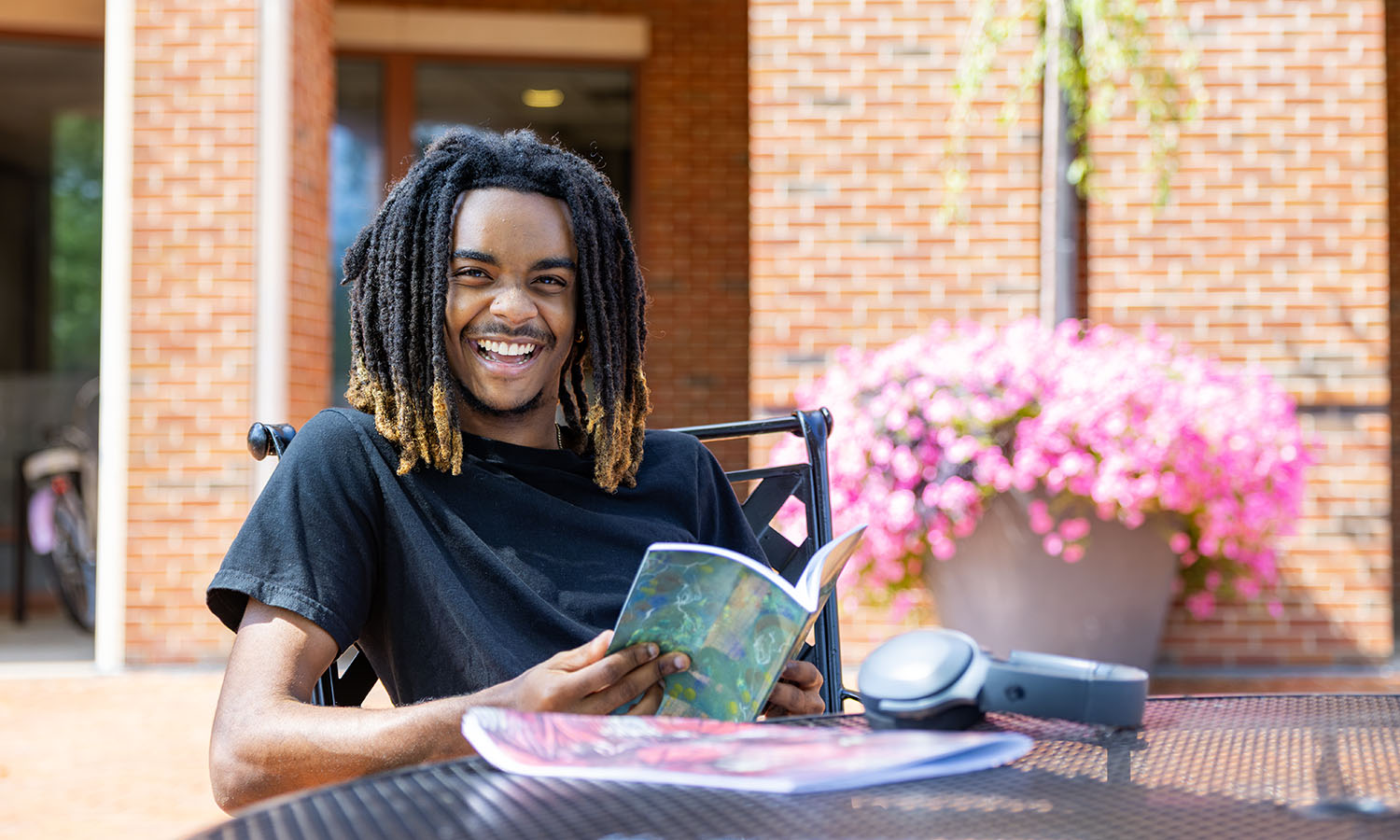 This week, we asked students to show us their favorite places on campus. Dylan Ballard ’28 enjoys reading on the patio outside of the Warren Hunting Smith Library.