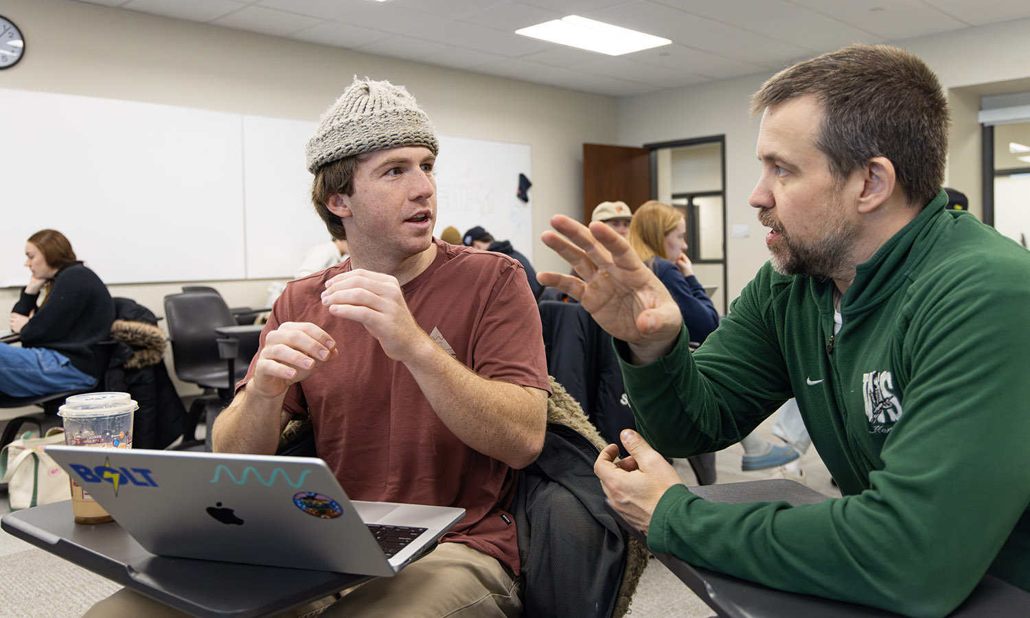 Cooper Delbridge '26 discusses a statistical model for his team’s interactive dashboard project with Professor of Mathematics & Computer Science Jonathan Forde during their Data Analytics Capstone.