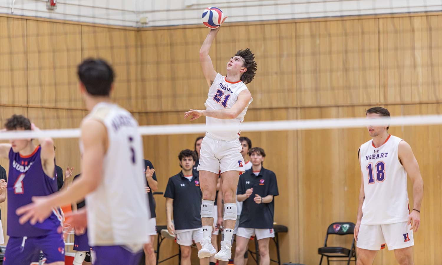 Harry Fromberg ’29 serves the ball as Hobart volleyball team swept Nazareth to move to 3-0 in UVC play. 