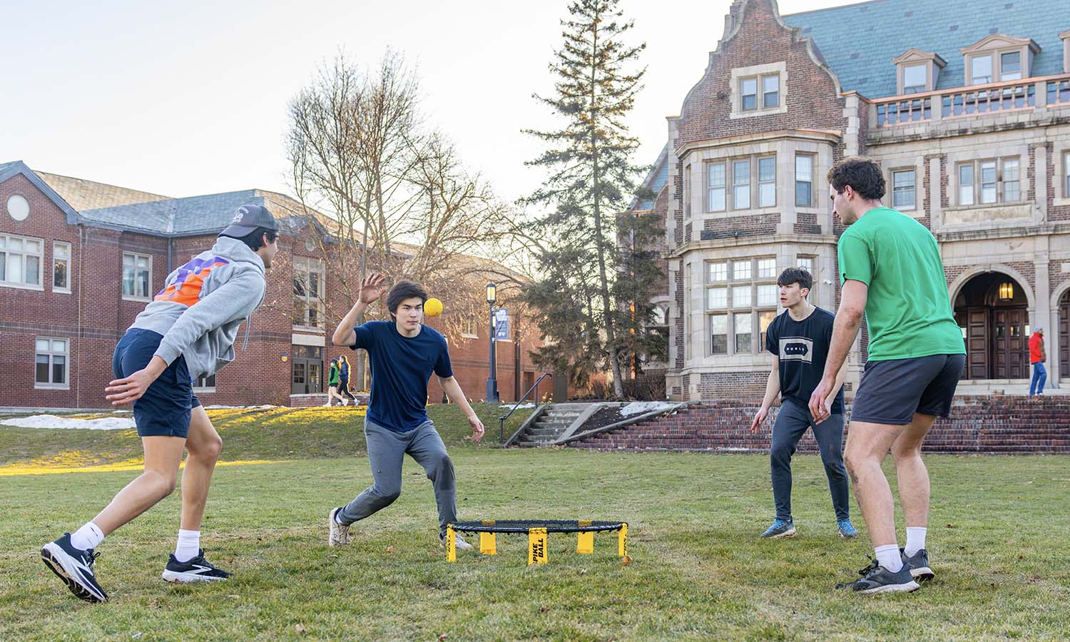 Students play Spikeball on the Quad. 