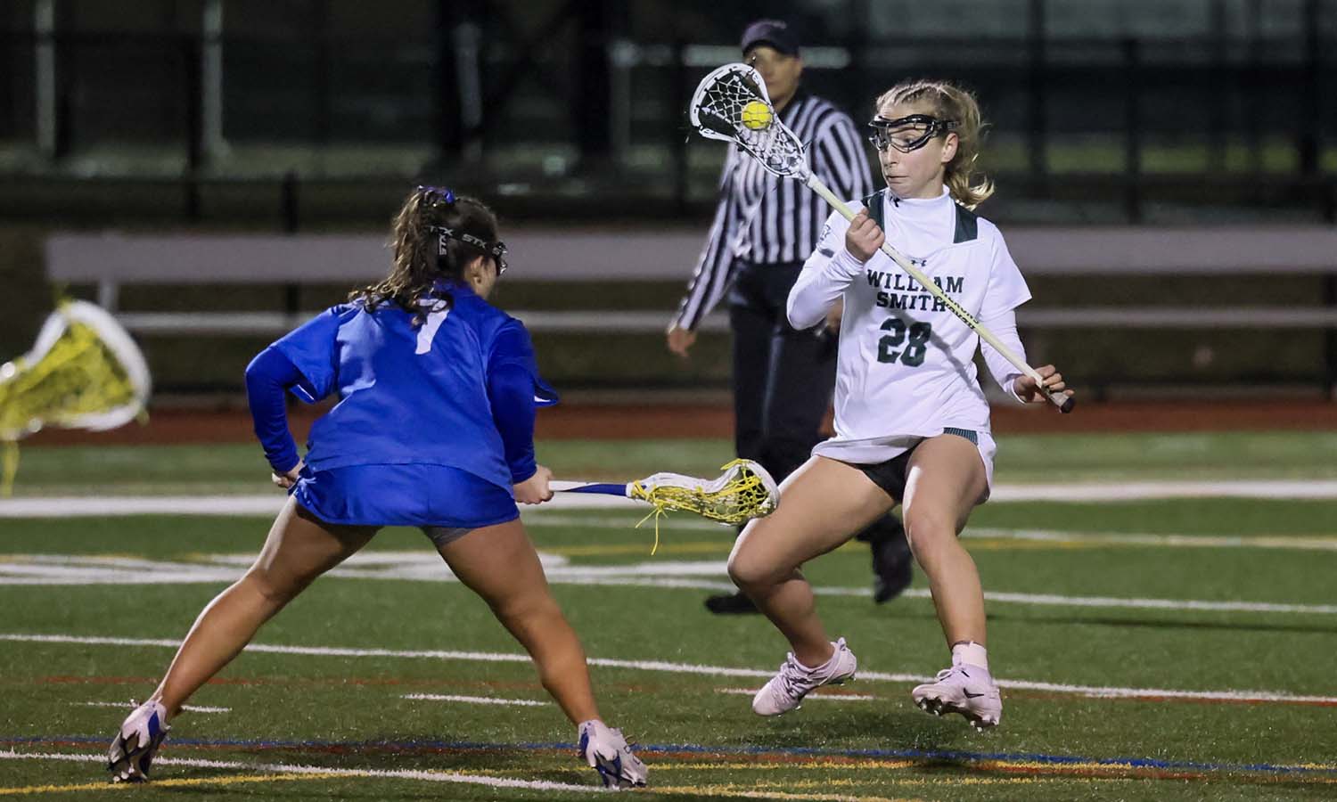 Katie Grottenthaler ’27 carries the ball in the offensive end of the field. The junior scored the game-winning goal with 2:53 remaining in regulation as William Smith beat Hamilton 10-9. 