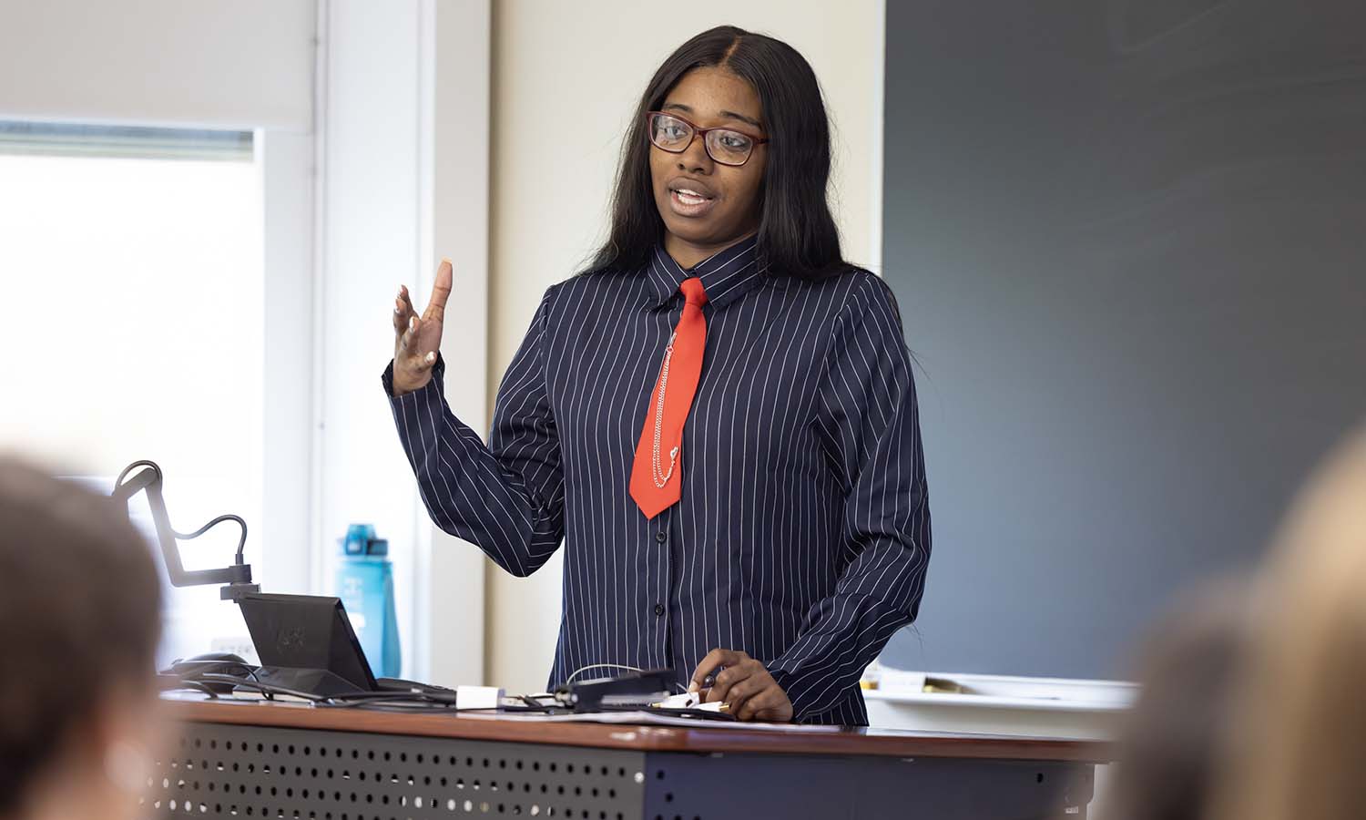 Heaven Miller '26 presents her research project, "Donald Trump's Rise as a National Conservative," during the Senior Symposium, part of HWS Day.  