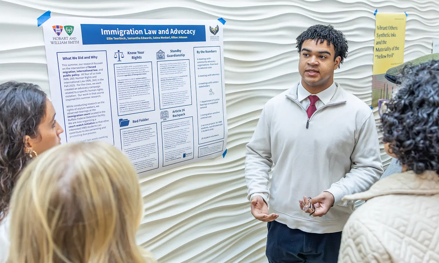 Hilton Johnson '29 discusses his research project with attendees of the Summer Scholars Research Symposium held in the Gearan Center for the Performing Arts.  