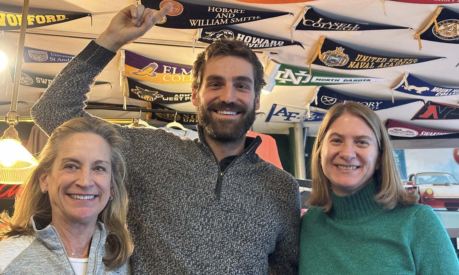 Senior Associate Director of Admissions Sue Willard '99 (right) catches up with Gina P'19 and Justin Podlesak '19 at a local coffee shop in New Canaan, CT.   