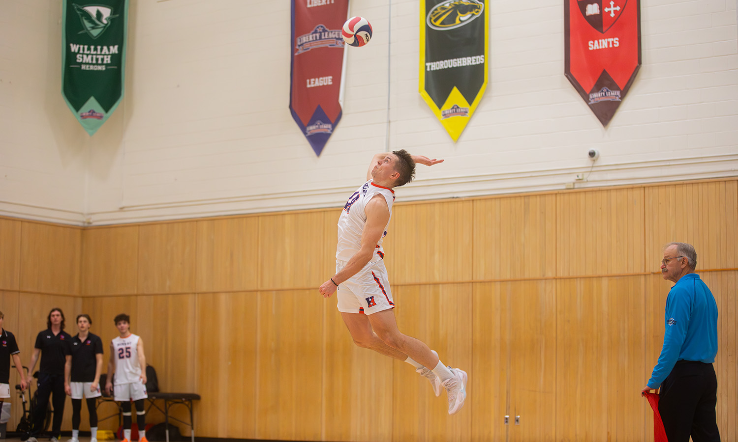 Aiden Kemora '27 serves up one of his career-high six aces as the Hobart volleyball team opens its season with a 3-0 sweep of Russell Sage on Friday. 