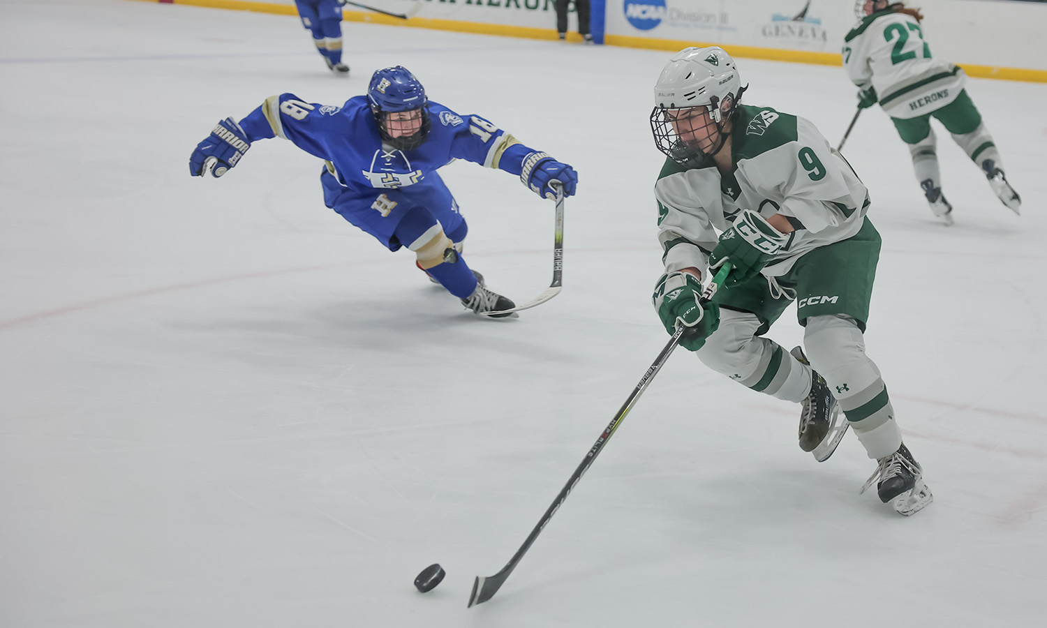 Ainsley Lonczak '28 skates the puck to safety during the Herons' ice hockey game against Hamilton College. 