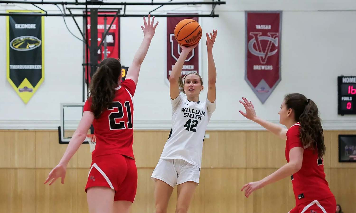 Amelia McCulley ’27 launches a shot during William Smith basketball’s game against RPI. 