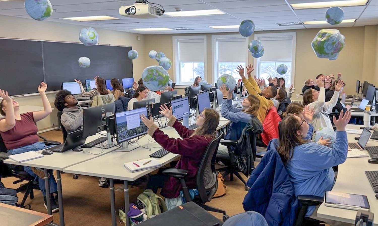 Students in “Biostatistics” with Professor of Biology Brad Cosentino use beach balls of the Earth to estimate the proportion of water on Earth. The activity allows students to understand how the process of sampling generates uncertainty in estimated quantities. 