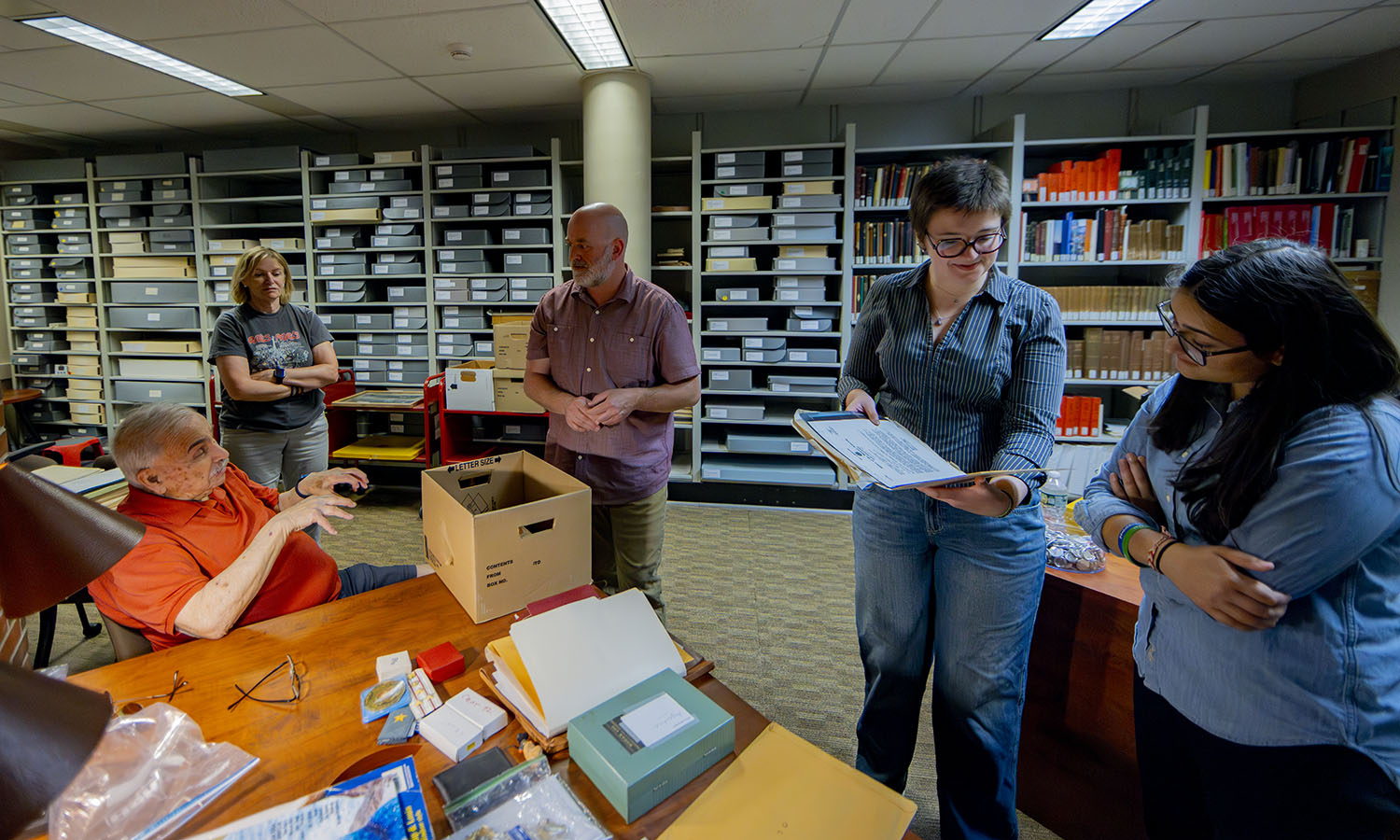 Dr. Lowell J. Levine '59 donates personal materials to the HWS archives. Levine is a retired forensic odontologist and Director of the New York State Police Medicolegal Investigations Unit. He investigated the deaths of President John F. Kennedy, Tsar Nicholas II and his family, Martin Luther King, Jr., and Josef Mengele. Pictured are Levine and his wife Cathy Levine, HWS Archivist and Special Collections Librarian Brandon Moblo, India Buff '27 and Presidential Fellow Sophia Mughal '25.   