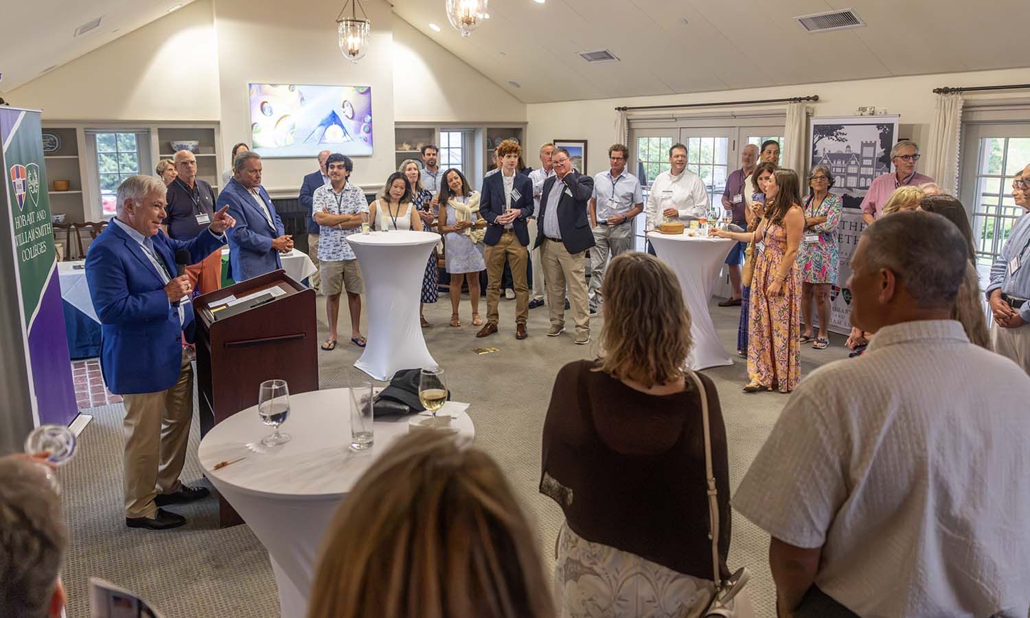 HWS Trustee Andy McMaster '74, P’09 welcomes guests to the HWS Summer Gathering on Cape Cod at the Eastward Ho! Country Club in Chatham, Mass. The event was hosted by McMaster and former Trustee Hank Holden '63, P'84, P'89, GP'20. 
