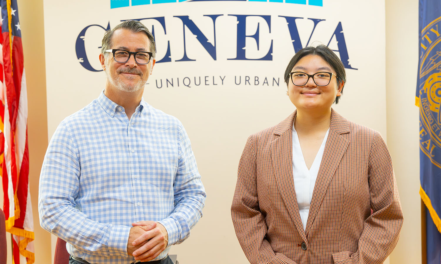 Geneva Mayor Jim Cecere '91 and Journey Horeis '28 pose for a photo in the City Council chambers. Horeis is interning with the Mayor's office this summer. 