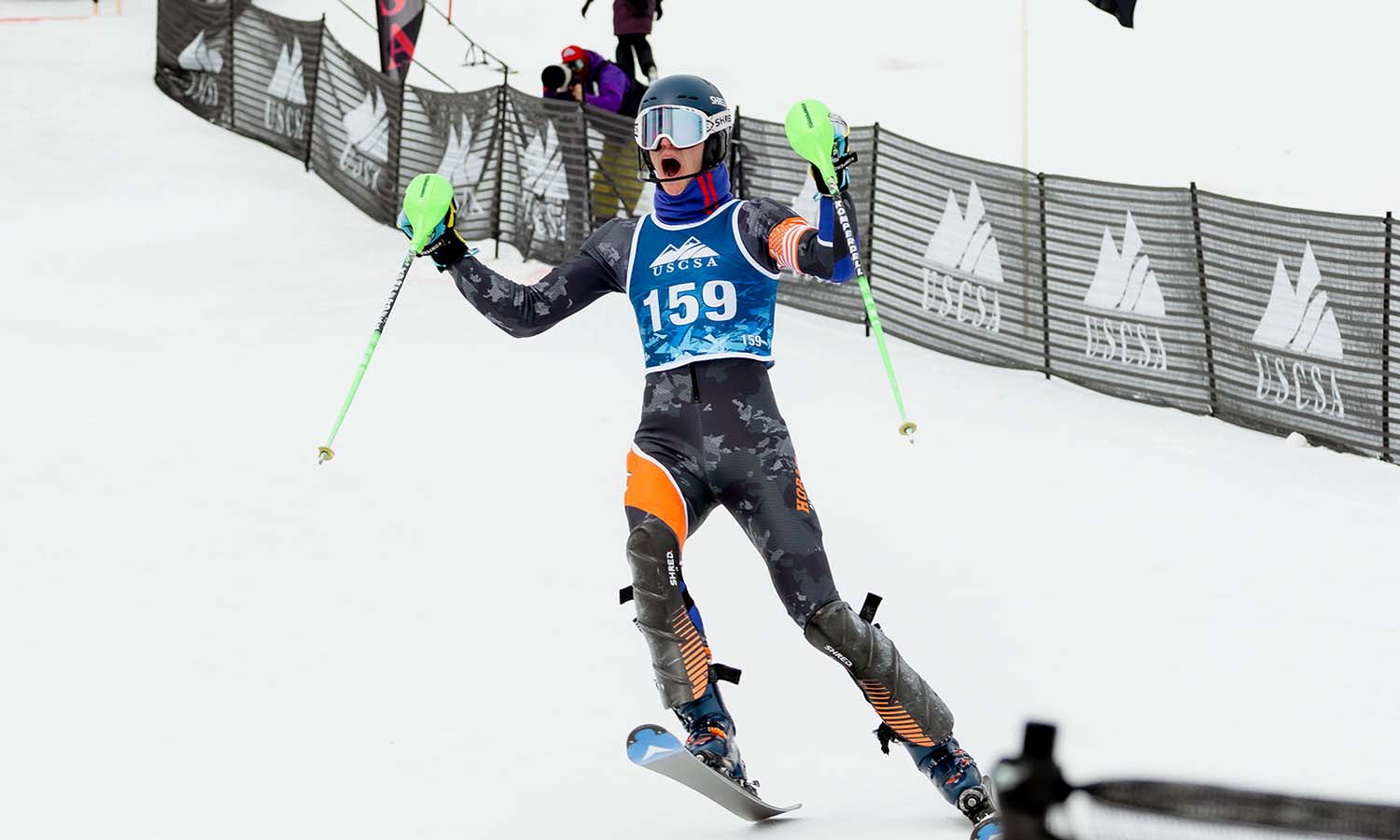 Will Patton ’28 celebrates after his run that earned him the 2026 USCSA Slalom National Championship in Lake Placid. 