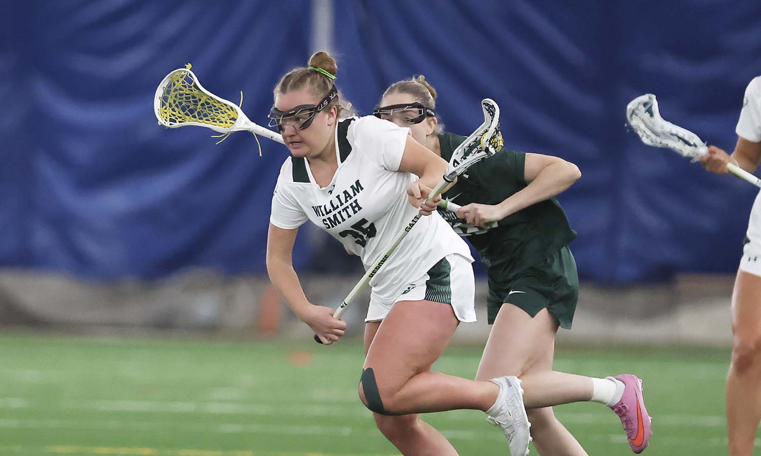Cat Colvin ’29 dodges a defender as she prepares to attack the goal in William Smith’s game against Skidmore. The Herons opened the Liberty League play with a 18-6 win over the Thoroughbreds. 