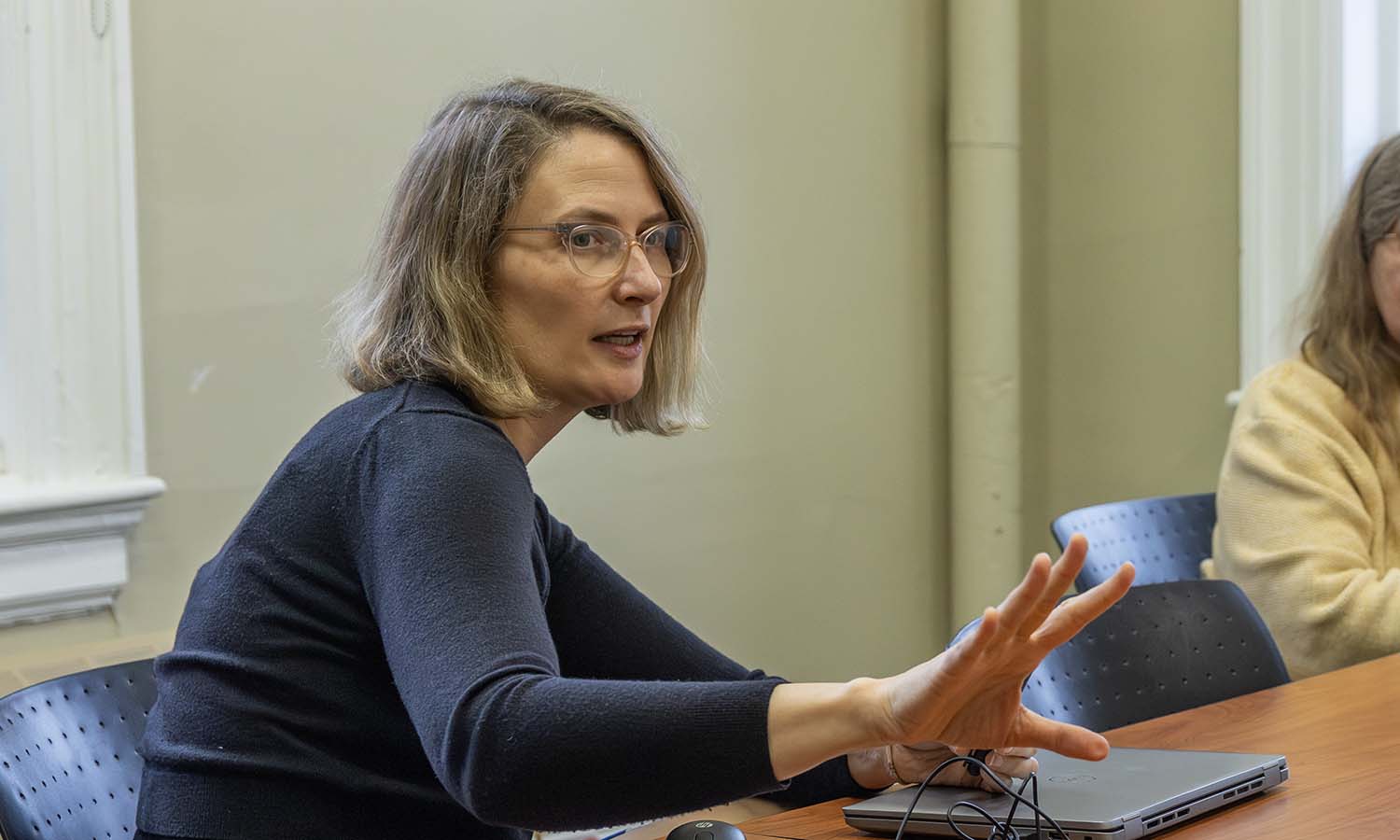 Professor of American Studies Elizabeth Belanger provides feedback to students on their project ideas during the American Studies senior seminar. 