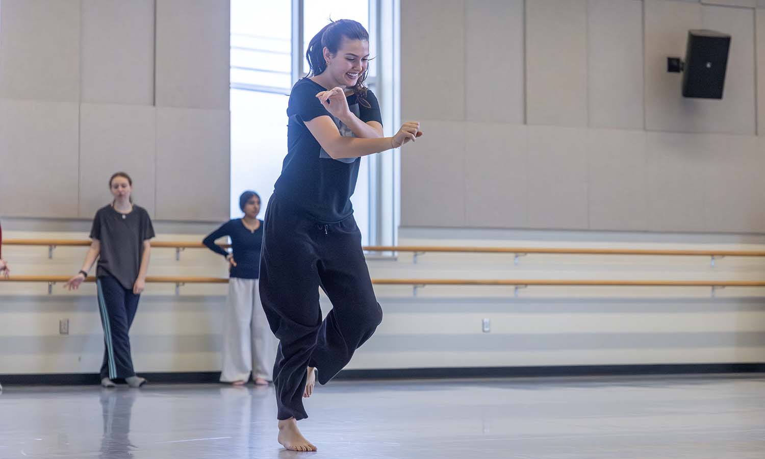 Isabella Mujevic ’26 practices a complex foot pattern during “Jazz Dance” with Associate Professor of Dance and Movement Studies Michelle Iklé. 