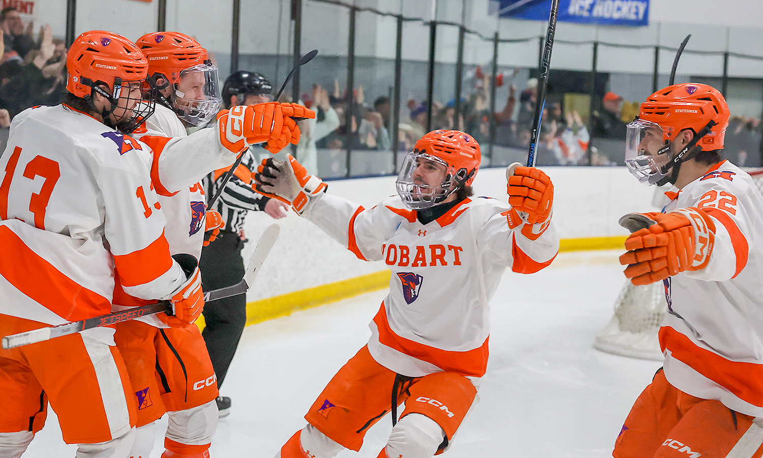 Tanner Daniels '26 and his teammates celebrate a goal during Hobart Hockey's 2-1 victory over St. Norbert in the NCAA DIII Ice Hockey Tournament to advance to the National Semifinals.&nbsp; 