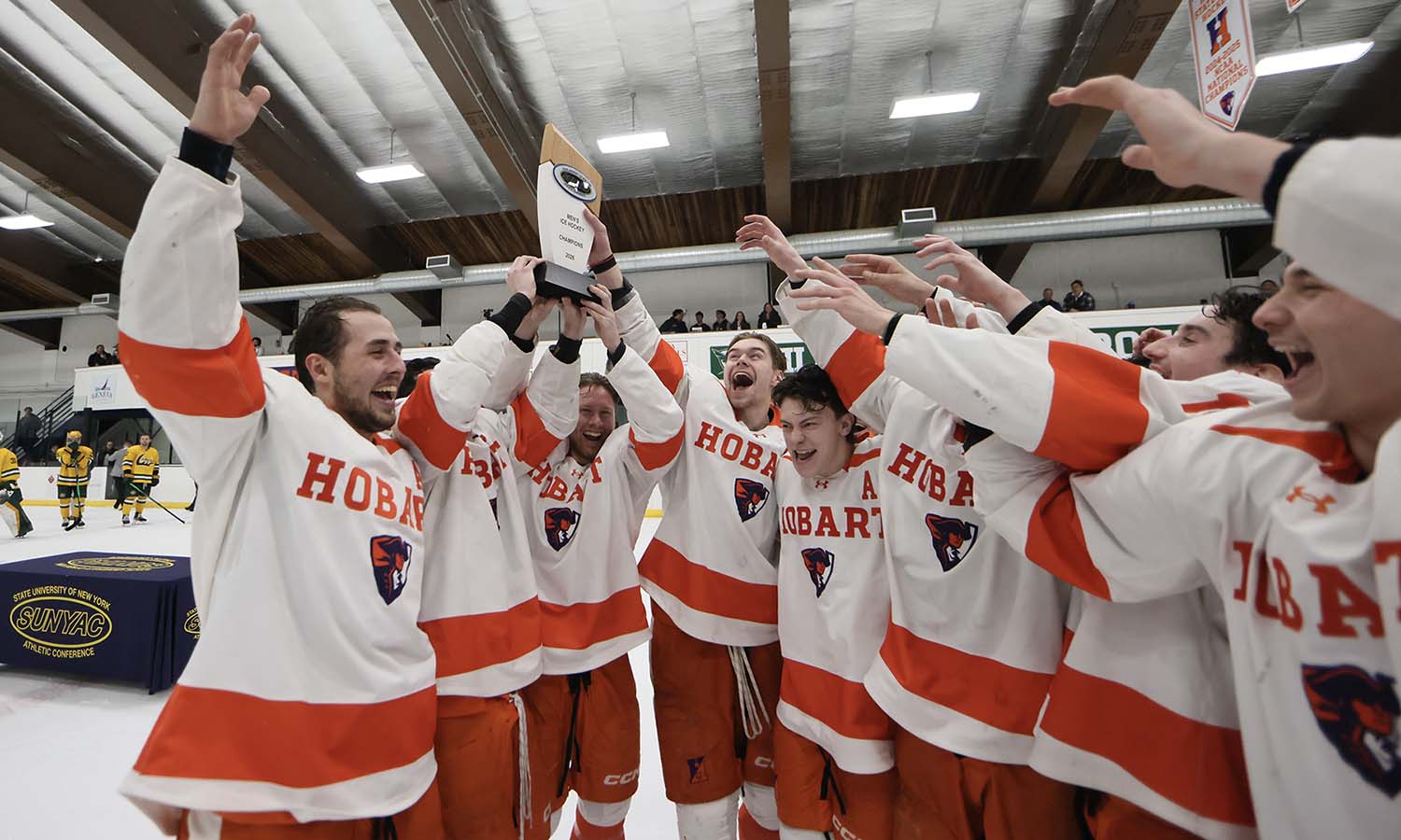 The Hobart hockey team lifts the trophy following their 4-0 victory over Oswego to claim the SUNYAC Championship. 