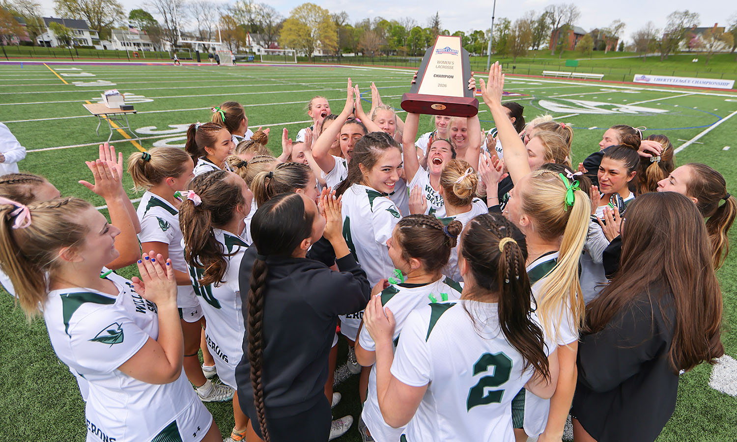 The William Smith lacrosse team celebrates their 10th Liberty League championship after defeating Union 13-8 at Urick Stadium. With the win, the Herons secured the Liberty League's automatic bid to the NCAA tournament. 
