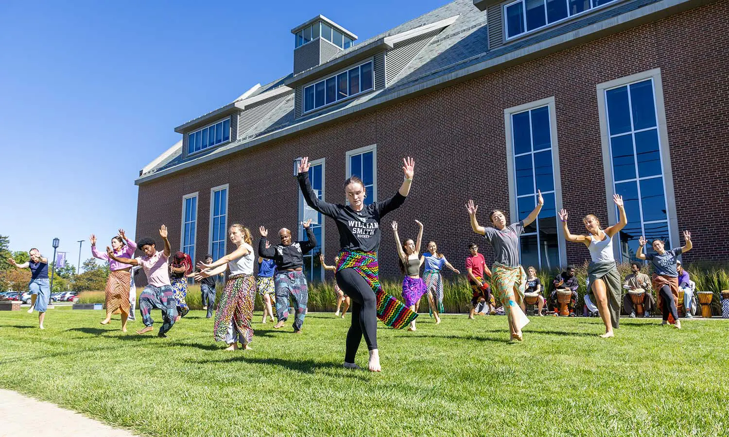 Students dance on the Gearan Center lawn during “Introduction to Jamaican Dance” taught by Associate Professor of Dance and Movement Studies Kelly Johnson. 