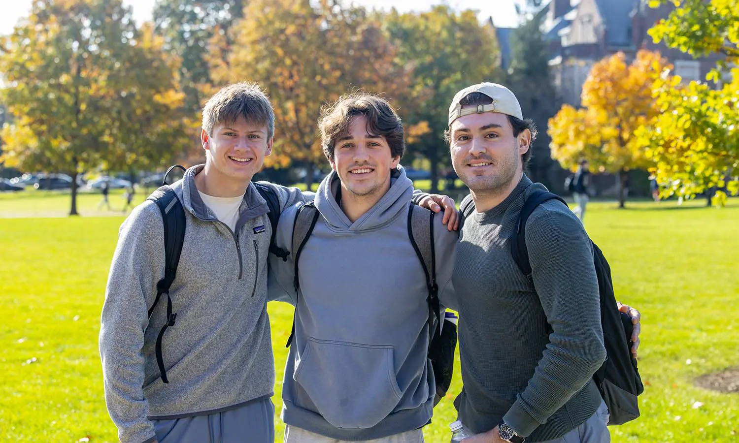 Andy Scoville '29, Tommy McDonough '29, and Brandon Sacchetti '27 stop for a picture while enjoying the fall weather. 