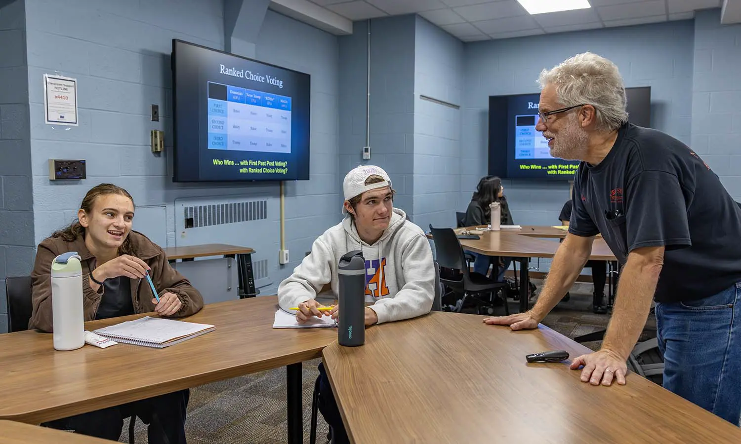 During “Puzzles and Paradoxes,” Professor of Philosophy Eric Barnes reviews the ranked choice voting method with Sydney Wolff ’30 and Braeden Chamberland ’30. 