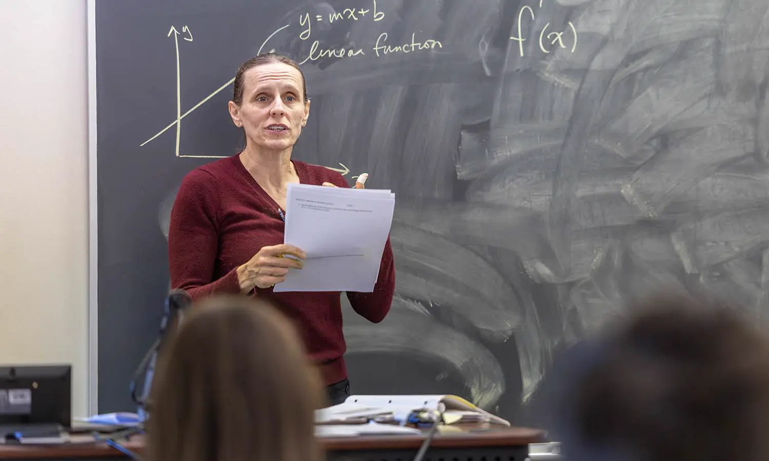 Professor of Physics Leslie Hebb works through a problem set with students in “Math Foundations of Data.” 