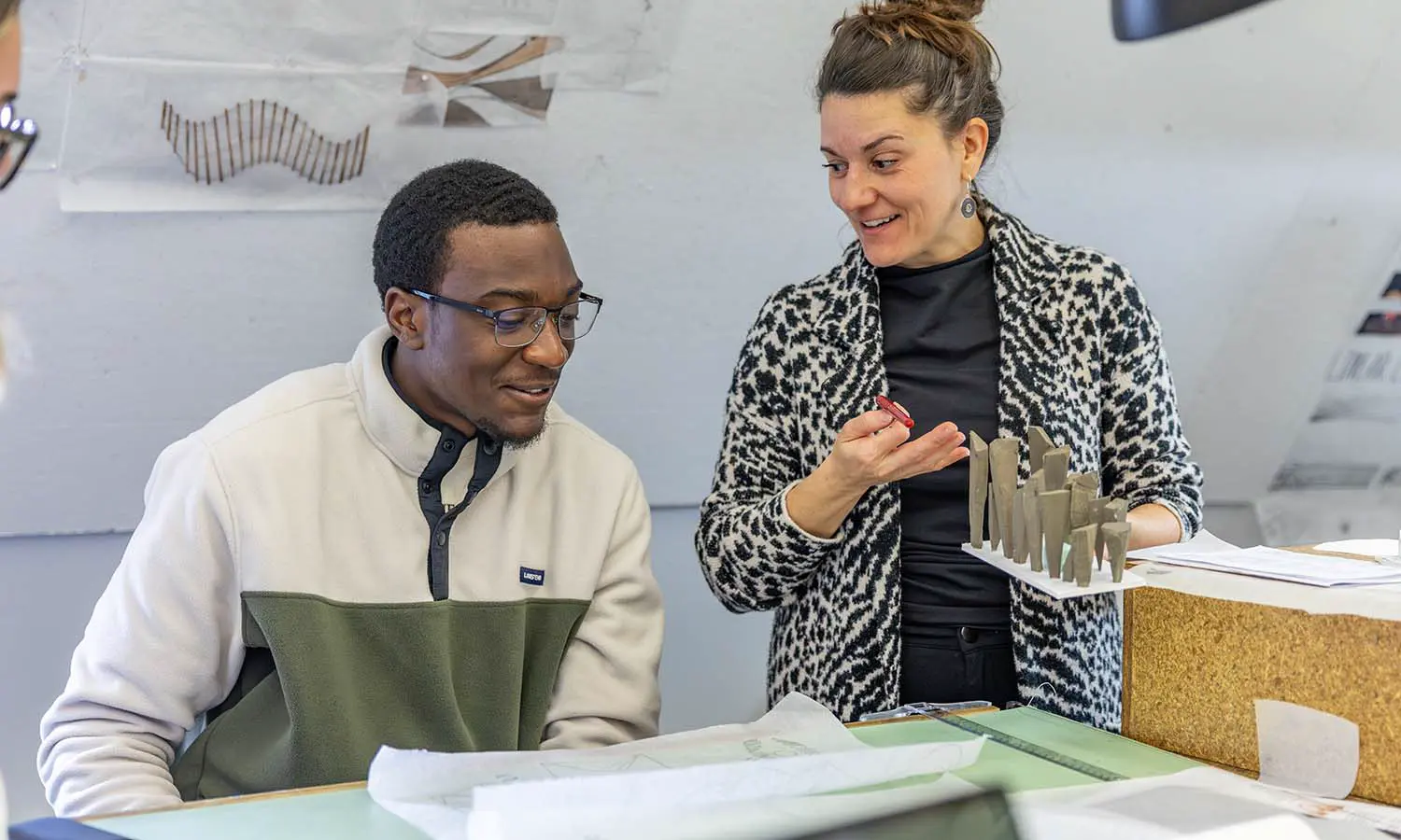 Associate Professor of Art and Architecture Gabriella D’Angelo provides feedback to Kiré Richardson '27 on his work during “Architecture Design Studio.”