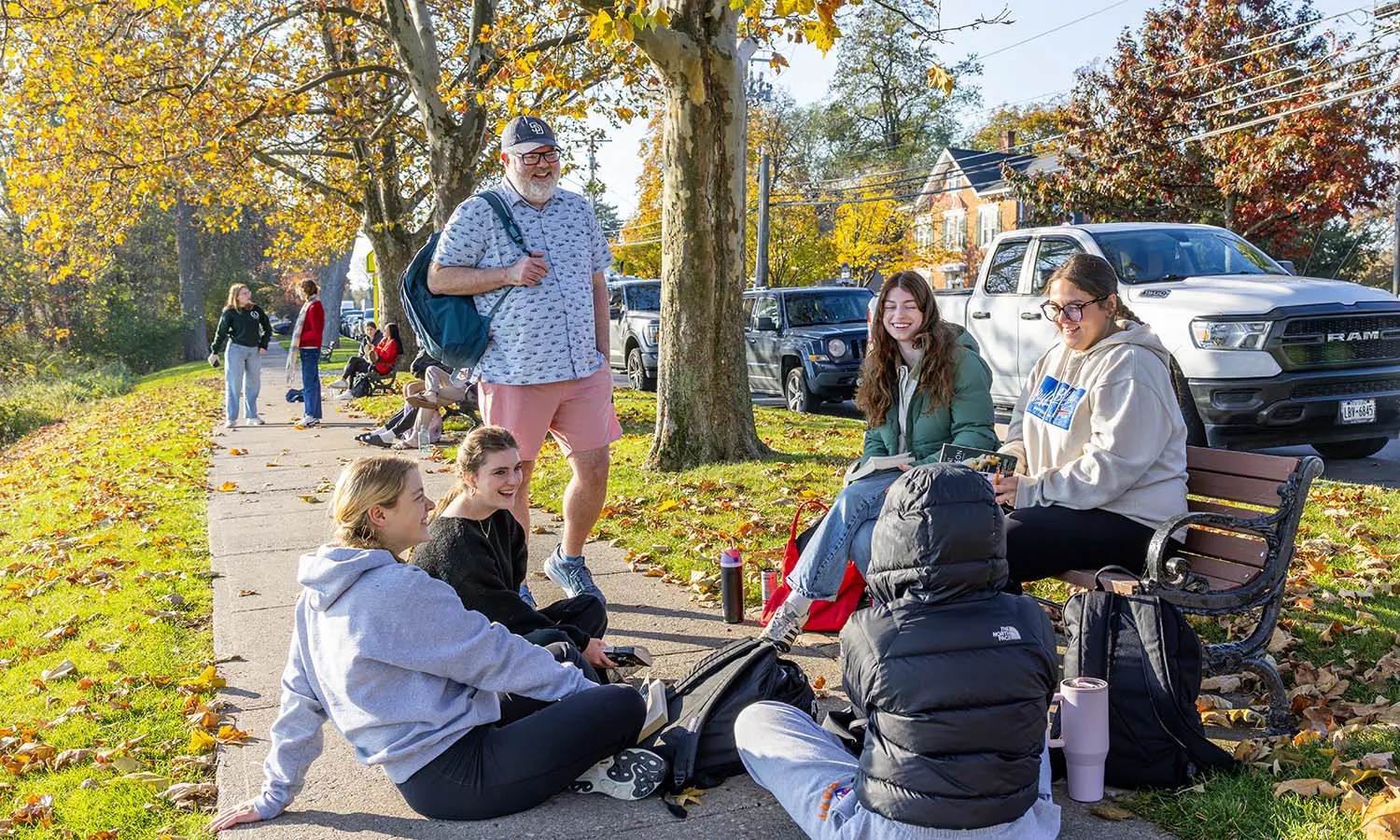 Professor of History Matthew Crow holds his FSEM “Matters of Memory” class on the benches along South Main Street. 