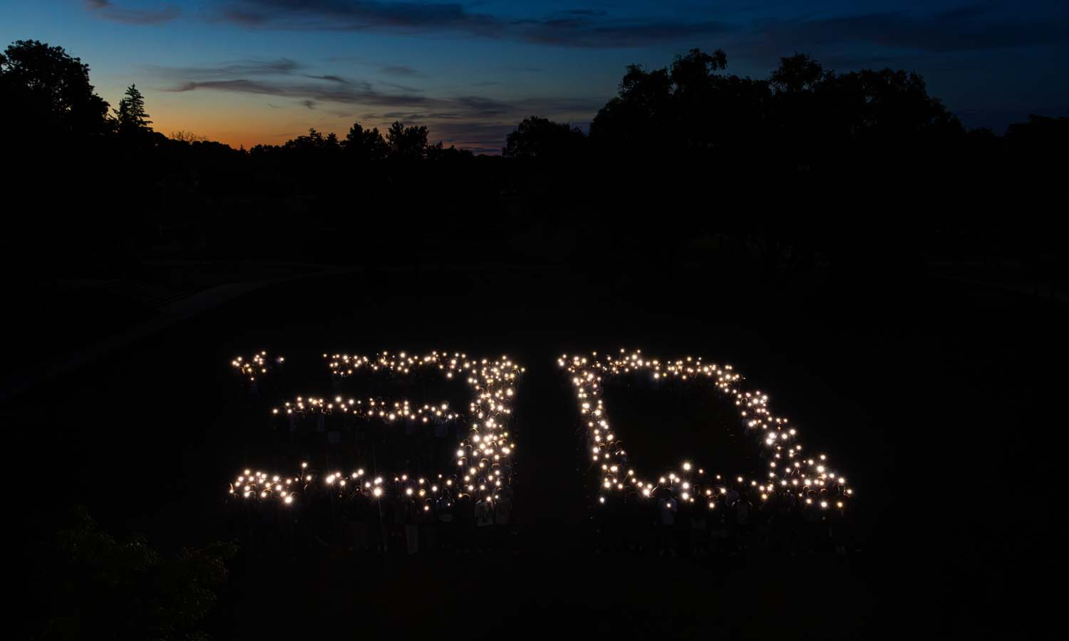 Students gather for Illumination on Bristol Lawn. 