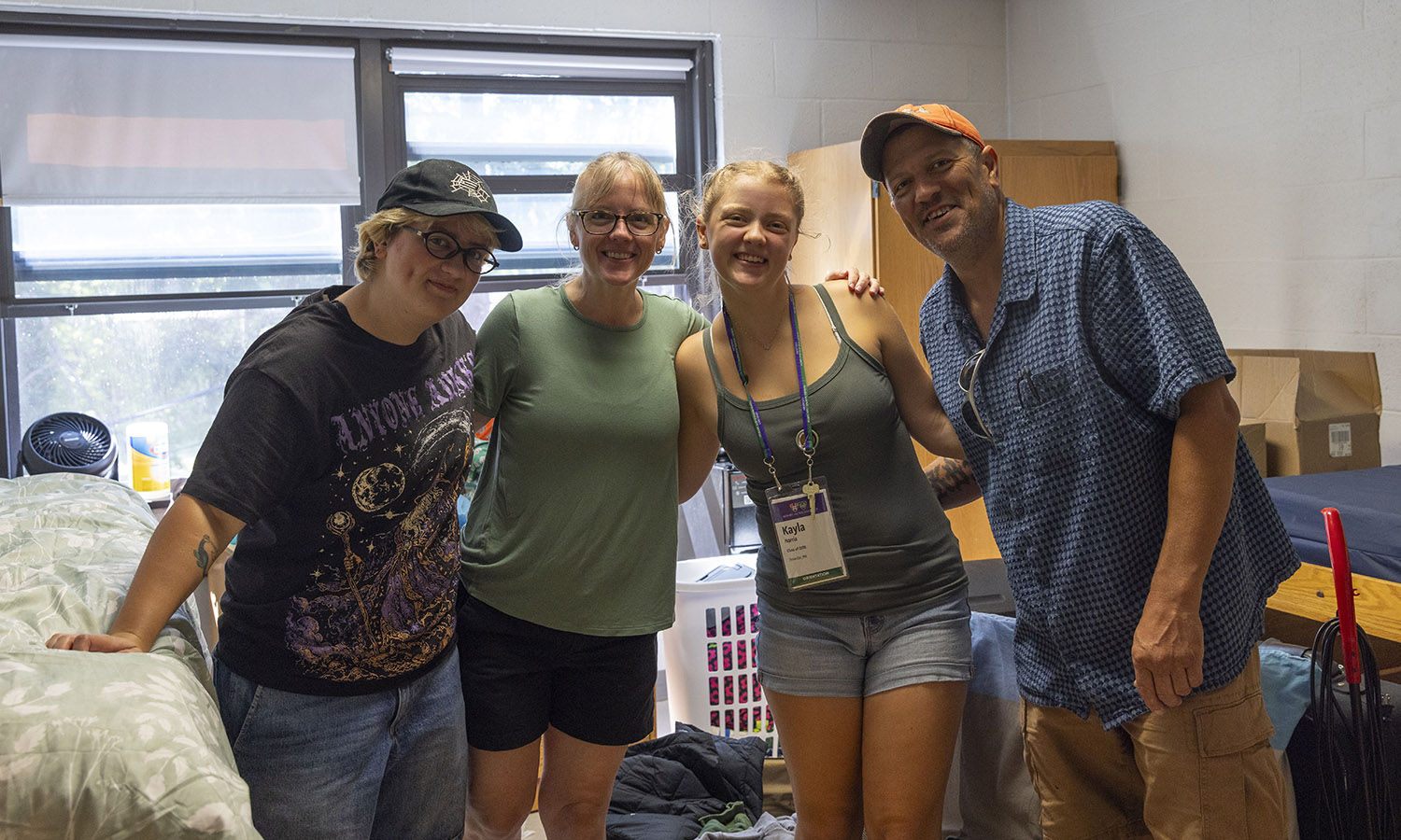 While moving-in to JPR, Kayla Harris ’30 of Brewster, Mass. and family pose for a photo.  
