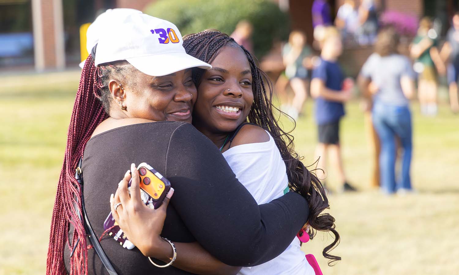 Kiara Williams ’30 gives a farewell hug after the President’s Welcome.  
