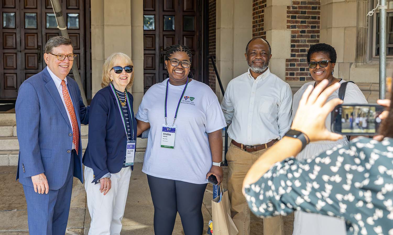 With family, Kristina Kolembe ’30 from Winona Lake, Ind. poses with President Mark D. Gearan and Mary Herlihy Gearan on the steps of Coxe Hall. 