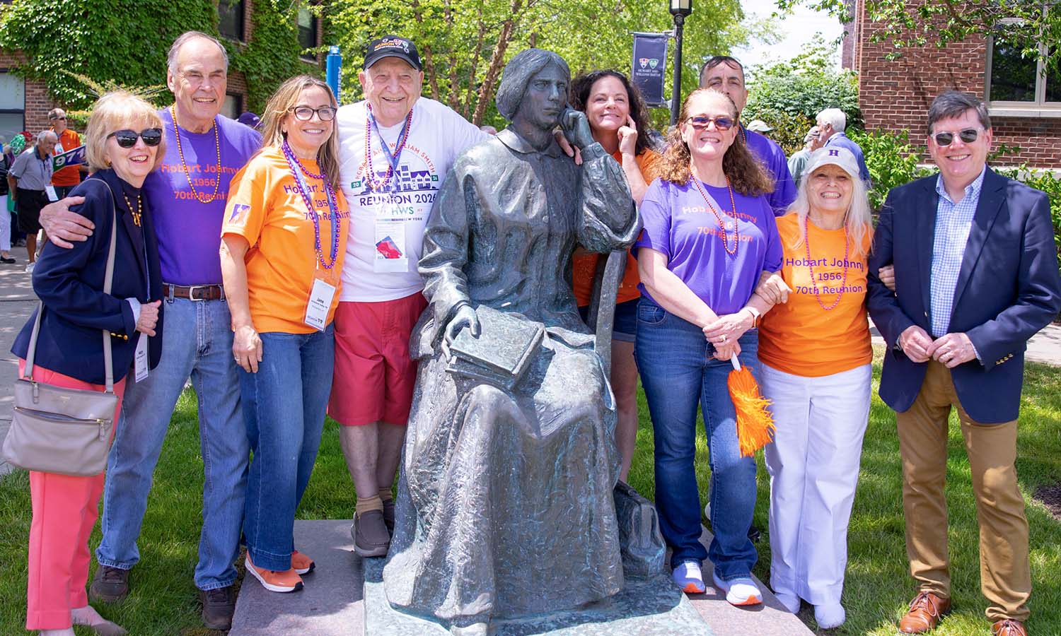 Mary Herlihy Gearan (left), President Mark D. Gearan (right), John McDermott ’56 (in white), and his family (all in t-shirts celebrating his nickname – ‘Hobart Johnny’), pose with the Elizabeth Blackwell statue.  