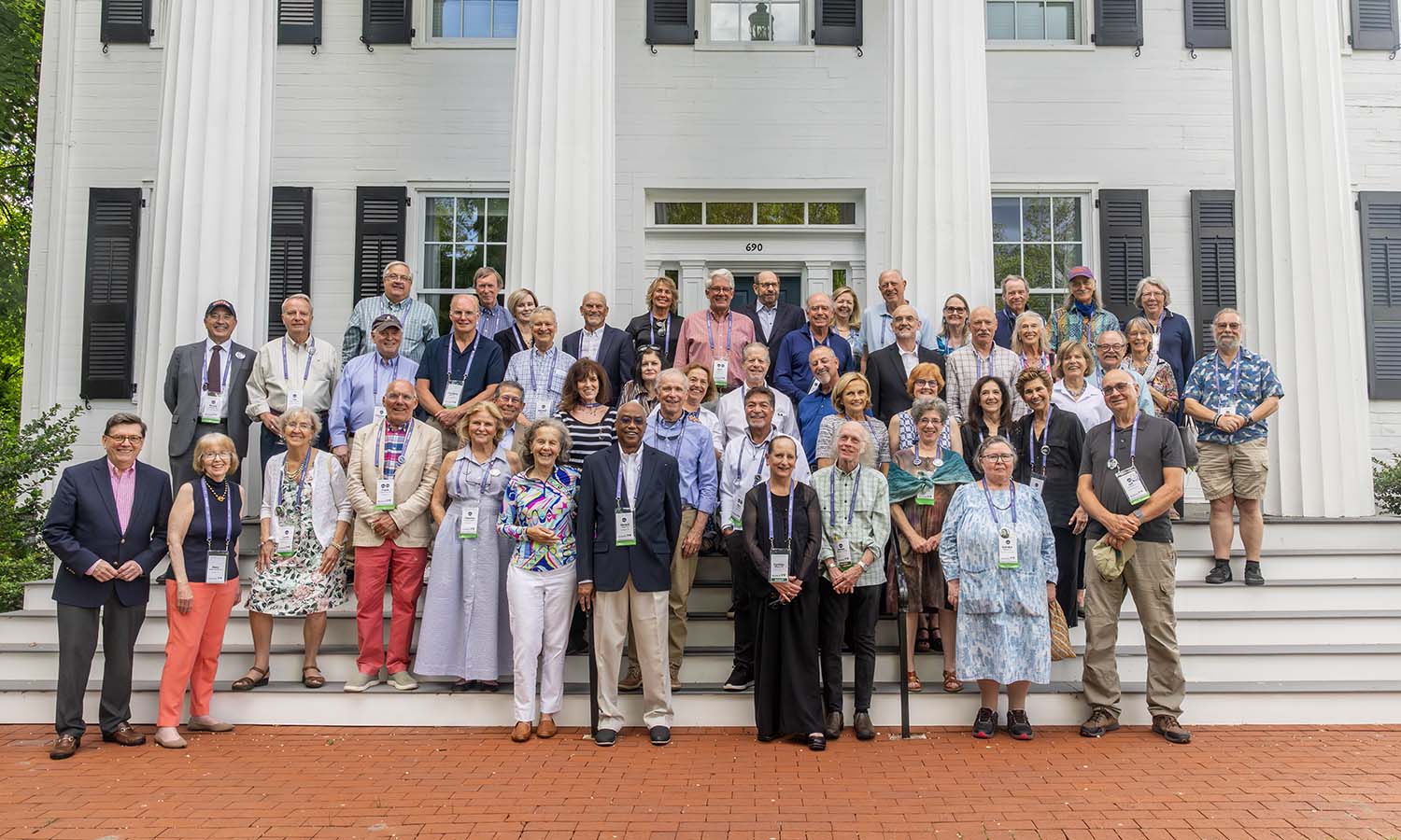 At the President’s House, members of the Class of 1976 and their spouses join President Mark D. Gearan and Mary Herlihy Gearan for a photo. 