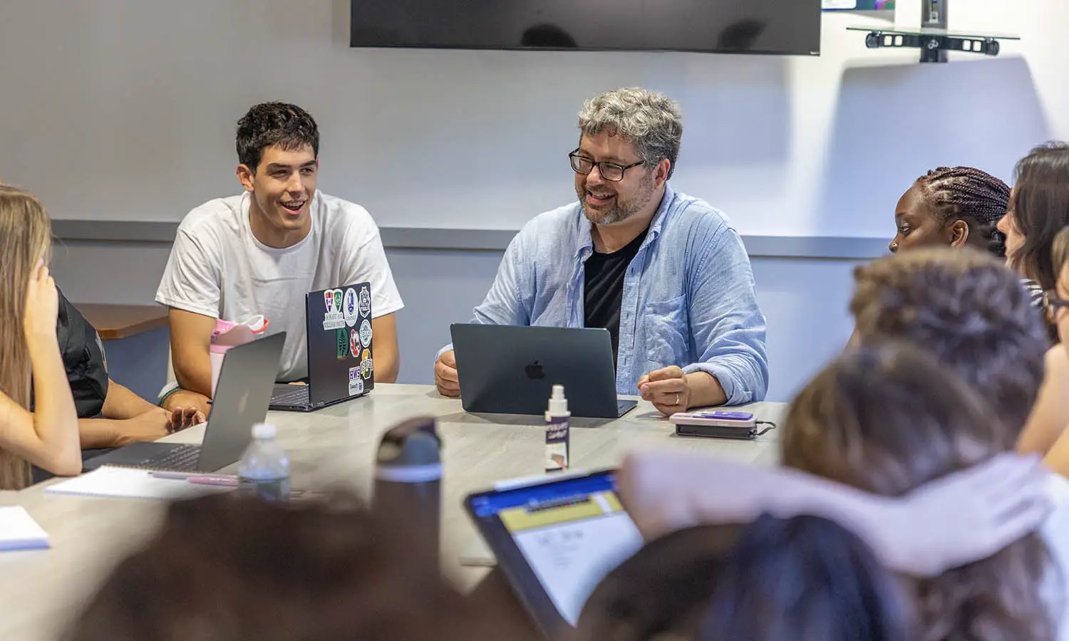 Associate Professor of English and Creative Writing Rob Carson speaks to students in “Screen Time.”