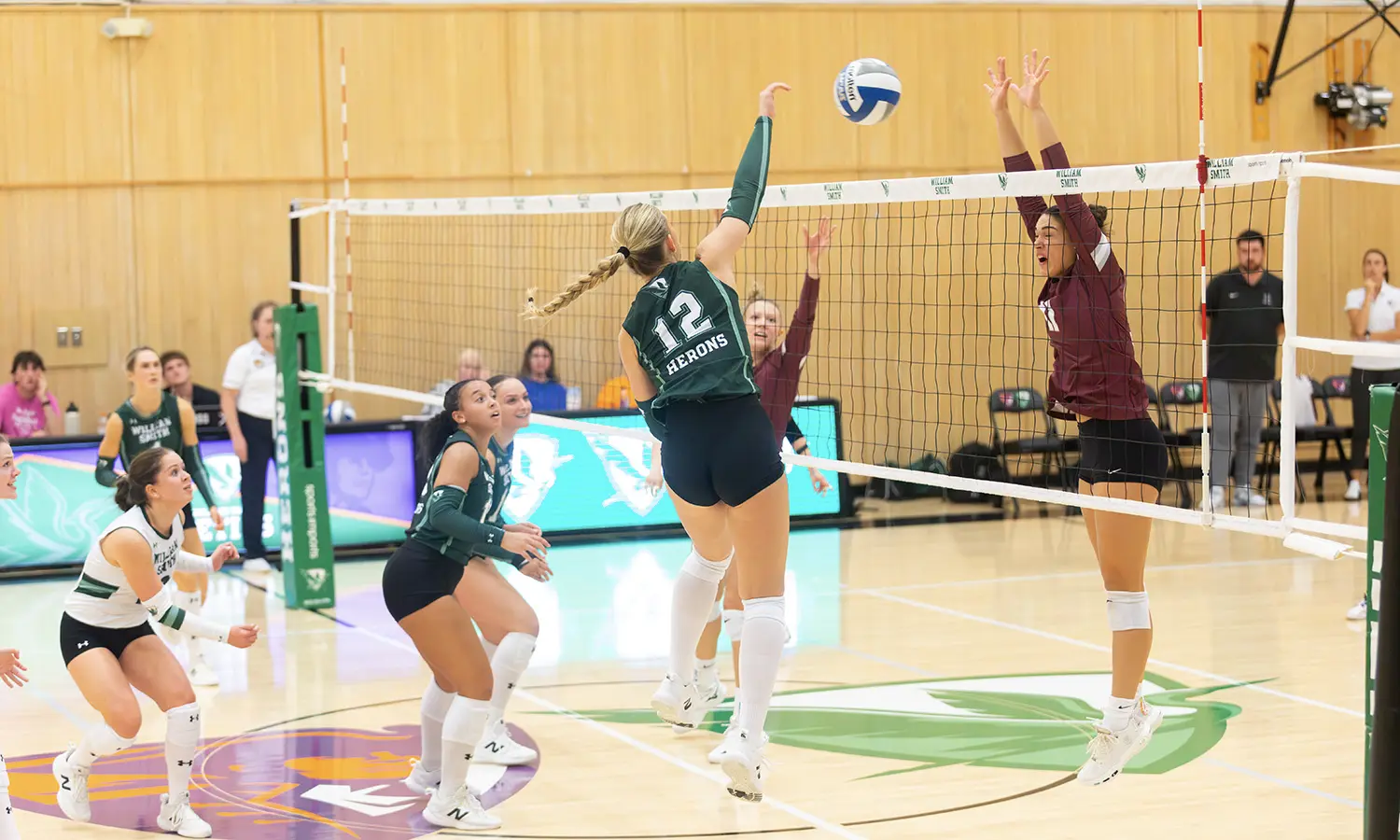 Senya Dorny '30 swings past the Union block as the William Smith volleyball team opened up Liberty League play with a 3-0 win over the Garnet Chargers. 