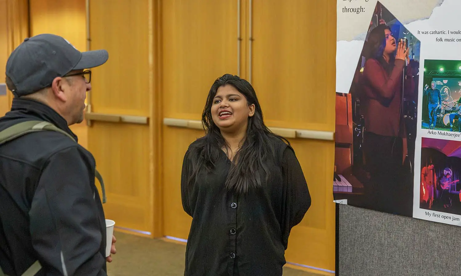 Fairooj Suhita '27 discusses Berlin's music scene with Associate Professor of Greek and Roman Studies Jim Capreedy during the Blocker Showcase held in the Vandervort Room. 