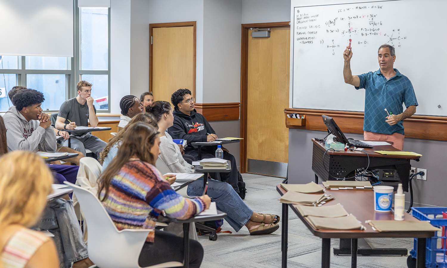 Professor of Chemistry Justin Miller leads a lesson during “Organic Chemistry I” on Monday morning.