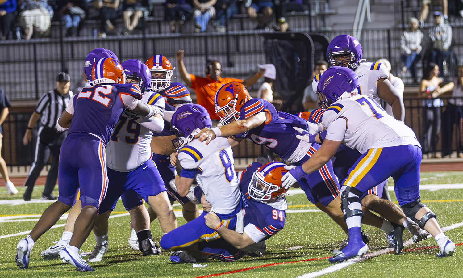 Hobart's defense swarms Alfred University's quarterback during the Statesmen's season opening 24-17 victory.  