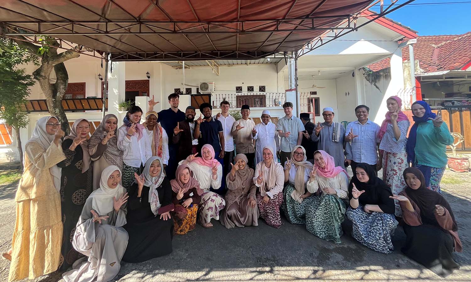 HWS visitors pose with faculty from the State Islamic University of Mataram during Eid Al Adha.  