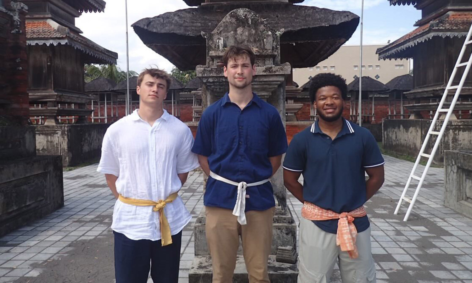 Parker Dudley ’28, Wyatt Tobin ’26 and Aaron Taylor ’27 gather at the Pura Meru Temple in Mataram. 