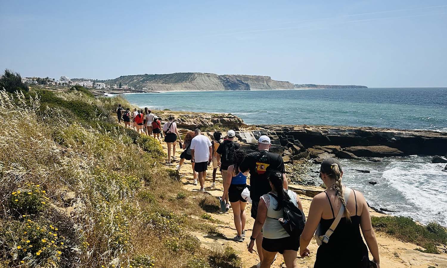 Members of the Heron volleyball program hike down the Algarve, Portugal coast. 