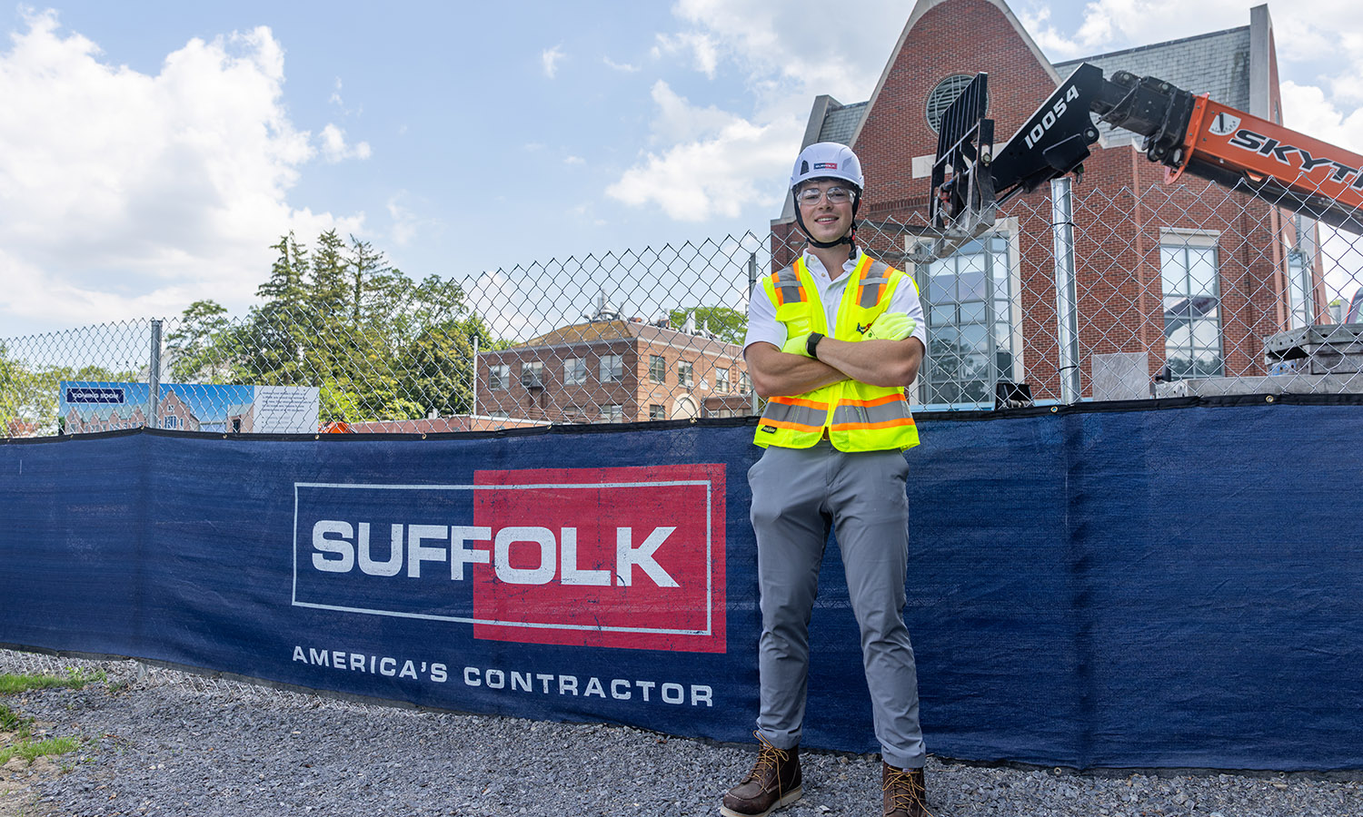 Price Morris ’28 stands at the Fish Center for the Sciences construction site, where he spent the summer as a Suffolk Construction Management Intern, gaining firsthand experience on the largest construction project in HWS history.&nbsp; 