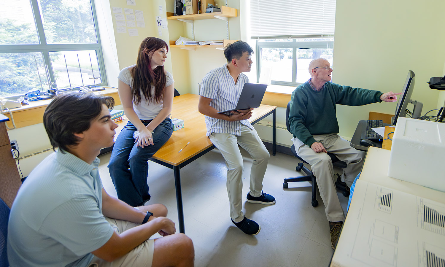 John Spicer '28, Michaela Riley ’27, Assistant Professor of Media and Society Jiangtao "Harry" Gu and Professor of Chemistry Walter Bowyer identify the yellow pigment used to depict Chinese population in the Statistical Atlas of the United States based on the 1870s census.  