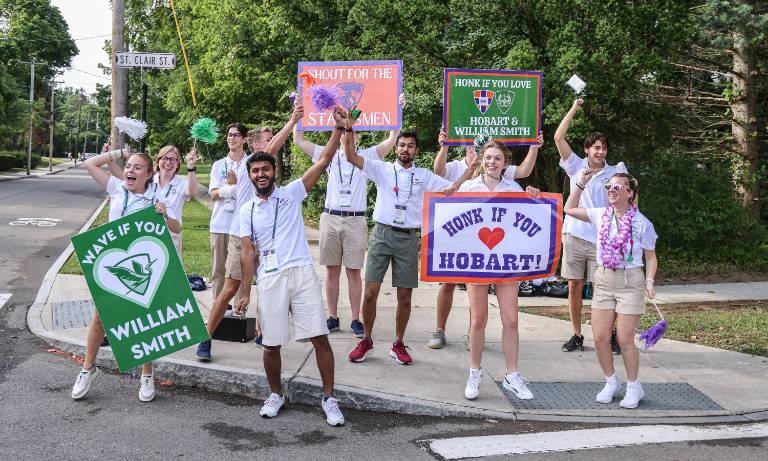 Current students welcome new students to campus.