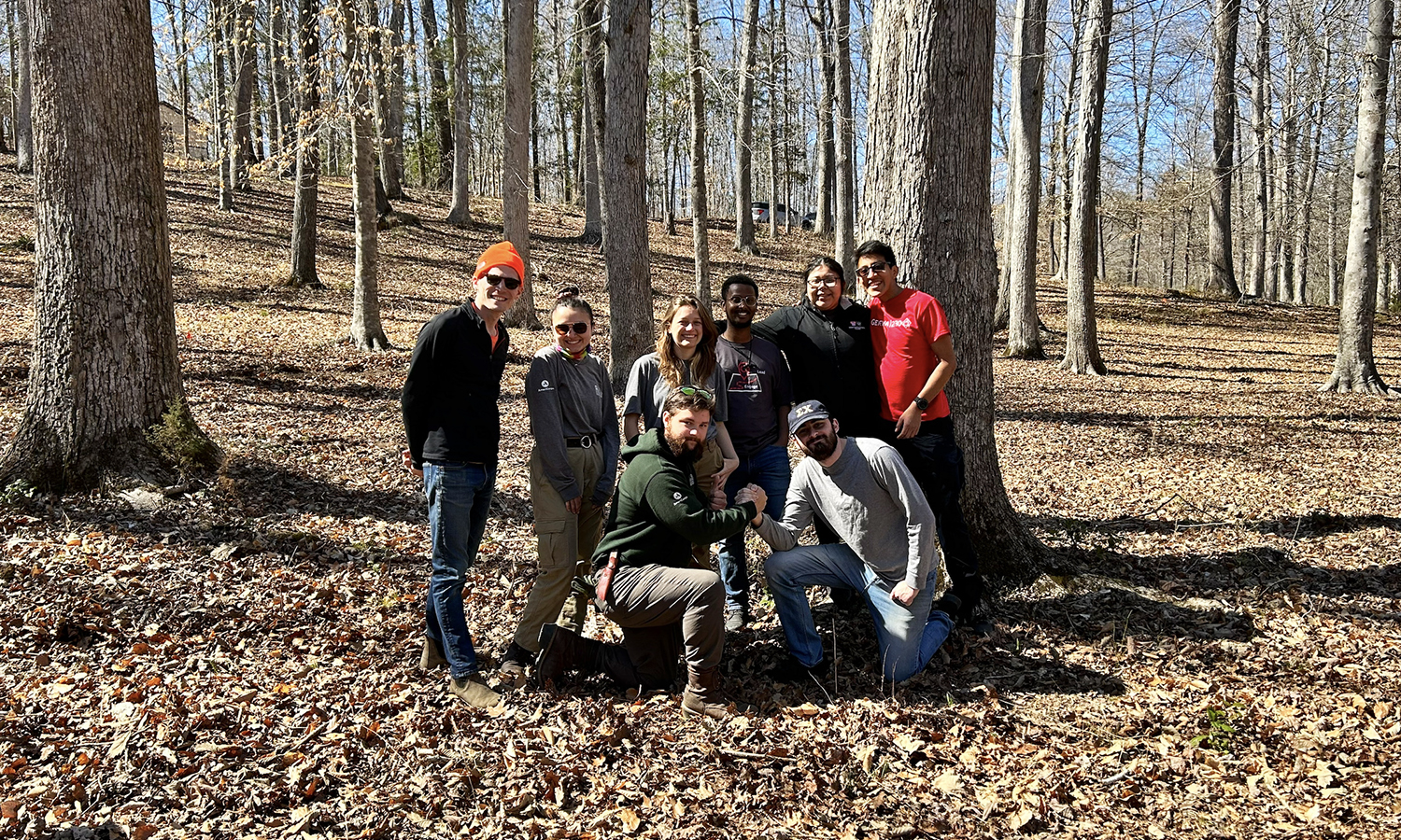 Assistant Director of the Center for Community Engagement and Service Learning Peter Budmen '15 (left) joins with students during an Alternative Spring Break experience at Pocahontas State Park in Virginia.